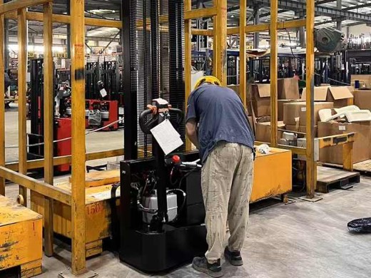 Accelift technician running a load and height test with a QC checklist