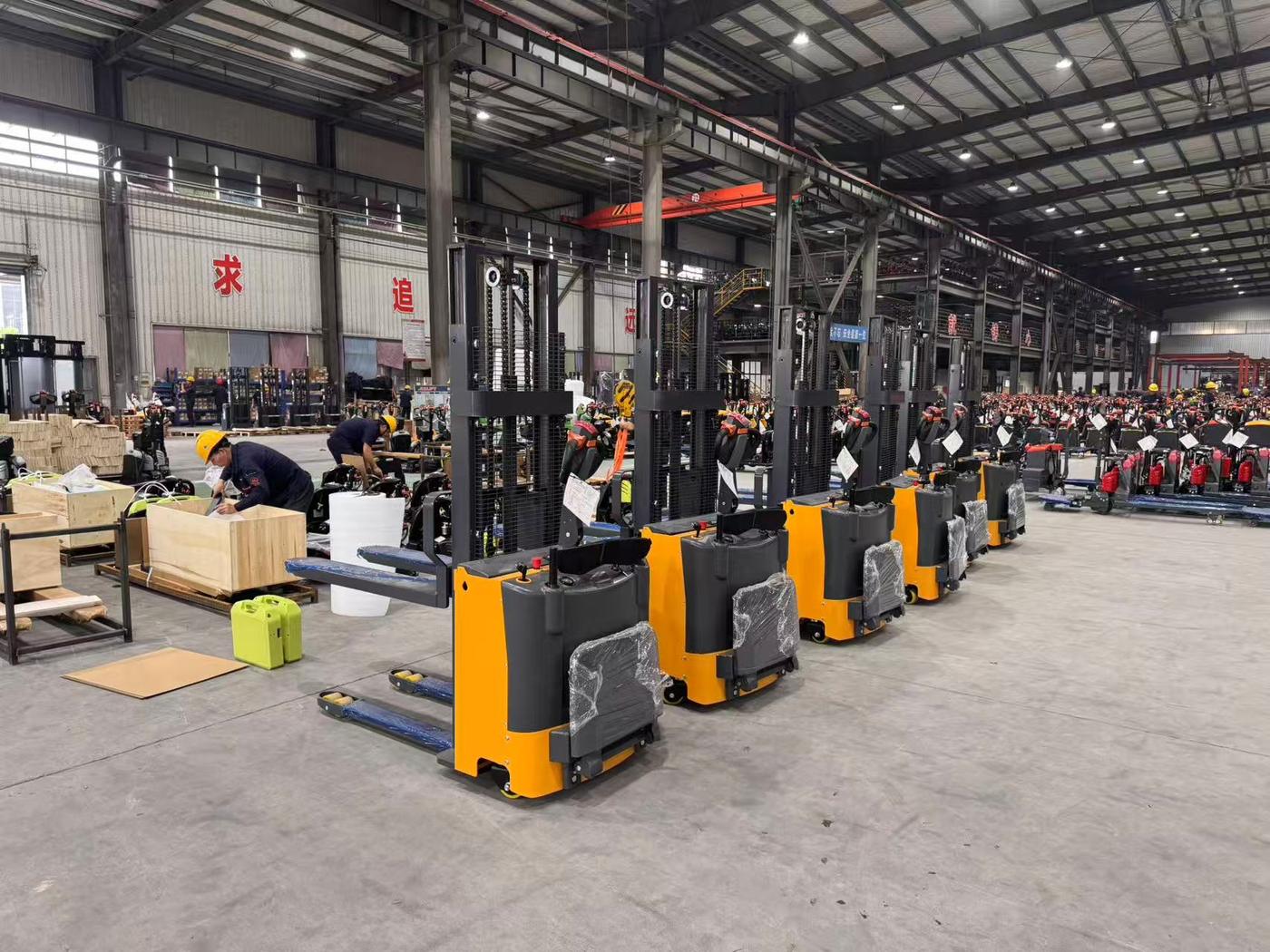 Row of Accelift electric stackers seen from behind before packing